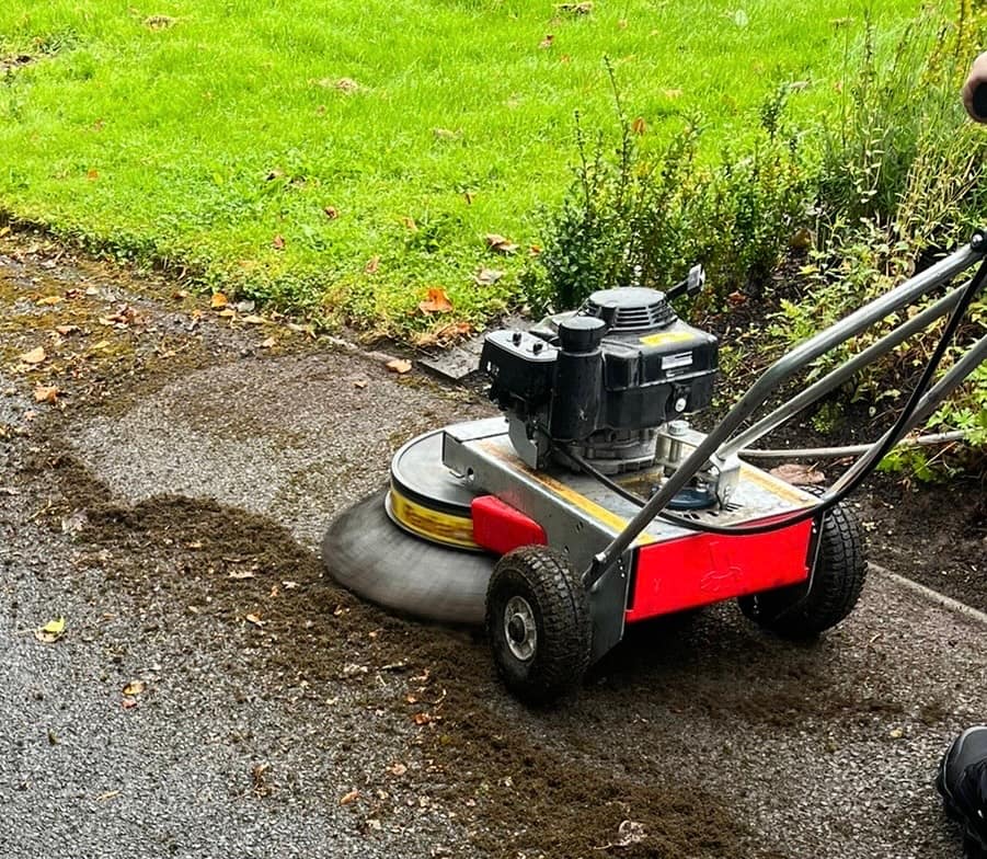 Driveway being cleaned with a rotary surface cleaner