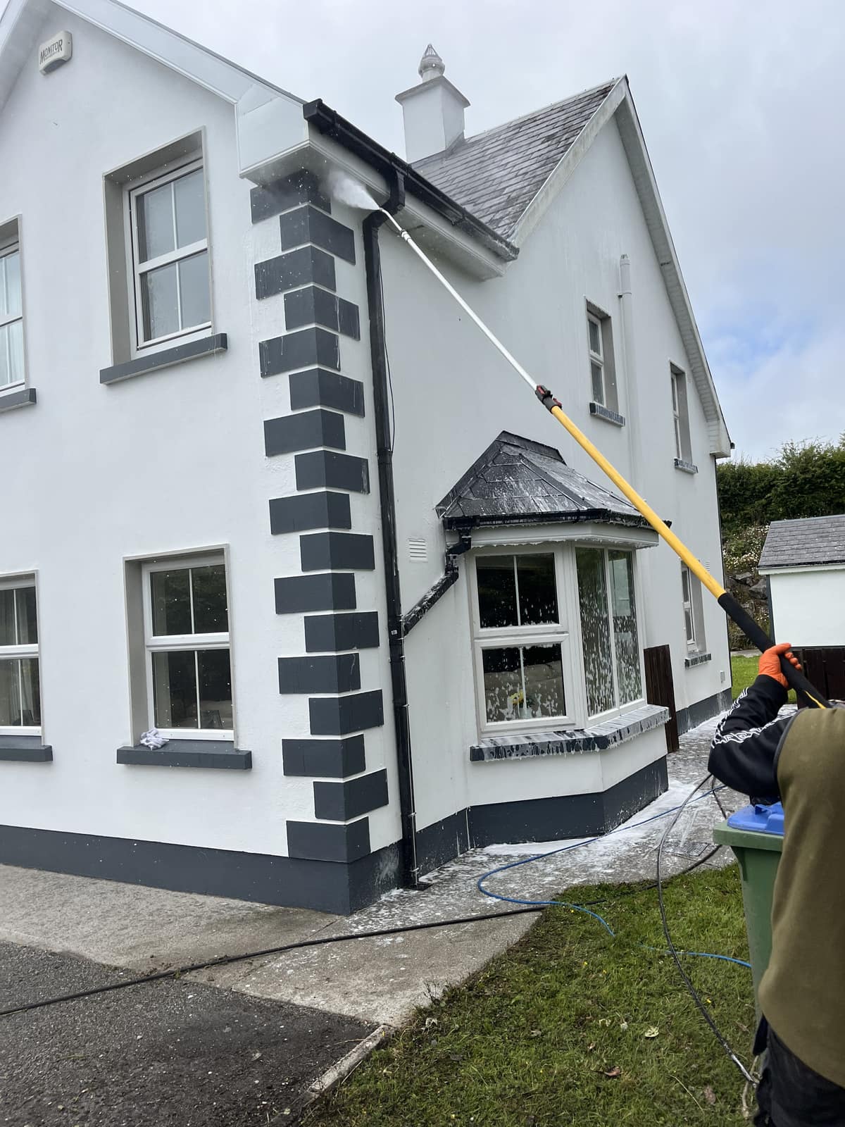 Gutter and fascia cleaning as part of a house washdown